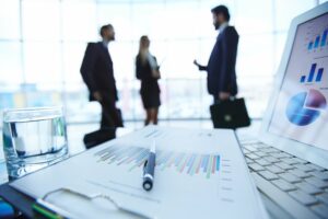 Business people meeting by a desk with financial reports