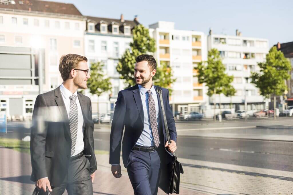 Two businessmen walking in the city